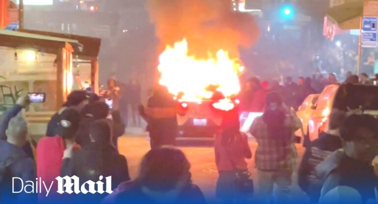 Angry crowd destroys driverless Waymo robotaxi in San Francisco with fireworks and skateboards