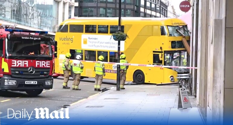Double-decker bus smashes through pub window near Oxford Street in London