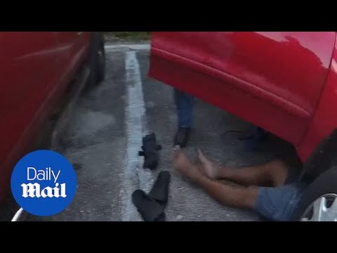 Dramatic moment police save man being crushed to death under car