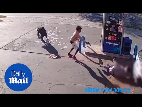 Stacks of cash go flying across gas station during armed robbery