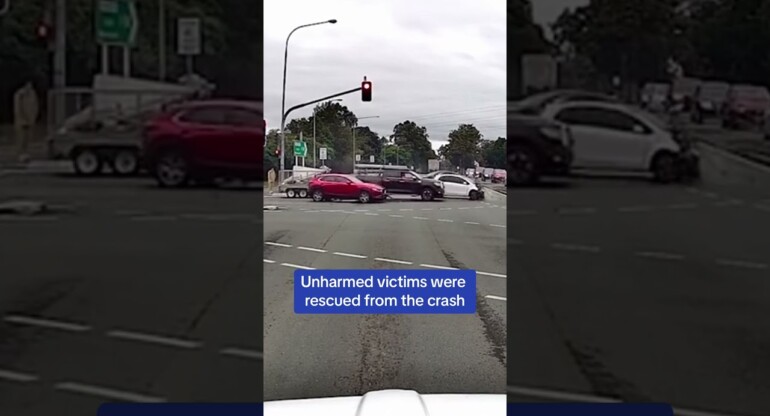 WILD moment a car flies through stop light at intersection