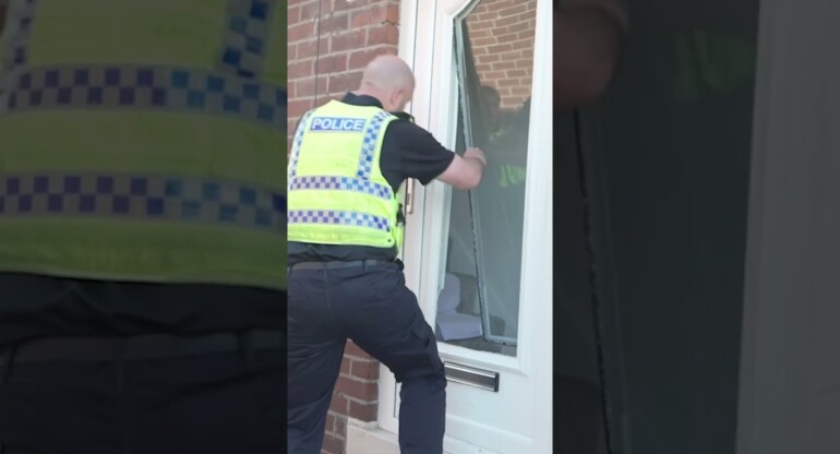 Police SMASH front door to arrest riot suspect